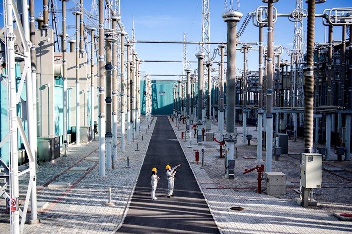 Staff inspect equipment in a substation in Zhangjiakou, Hebei on Aug. 18. Photo: VCG